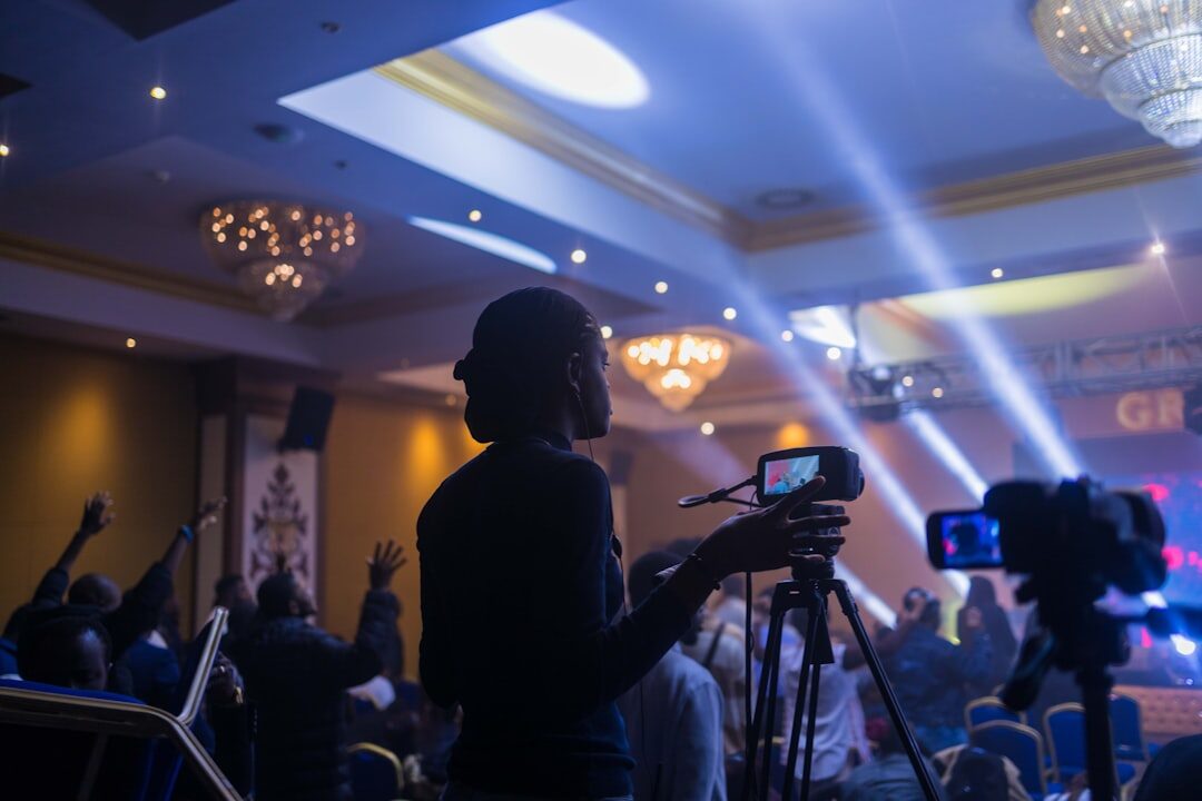 Live streaming event with screens and audience